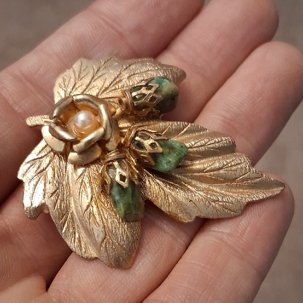 Gold-Tone Leaf Brooch with Green Stone Accents and Faux Pearl
